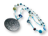 Long Gemstone and Myan Calendar Inspired Pendant