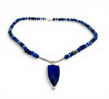 Blue beaded necklace with a large blue pendant on a white background. Blue Opal Necklace.