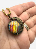 Book Lovers Moon Necklace shown on hand for size