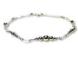 Bracelet with silver and gold filled beads on a white background