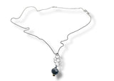 Necklace with a dark bead on a white background bubble necklace 
