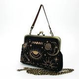 Black handbag with celestial designs on a white background