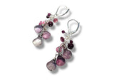 Pair of earrings with pink and purple beads on a white background