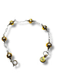 Bracelet with yellow and gold beads on a white background