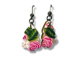 Pair of earrings with floral design on a white background