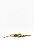 A close-up of a gold chain bracelet or necklace clasp and extender chain on a clean white background.