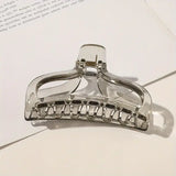 Clear hair clip on a light background