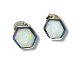 Hexagonal opal stud earrings on a white background