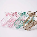 Set of colorful hair clips on a white background