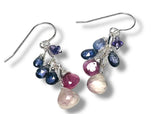 Jewelry set with multicolored gemstones on a white background