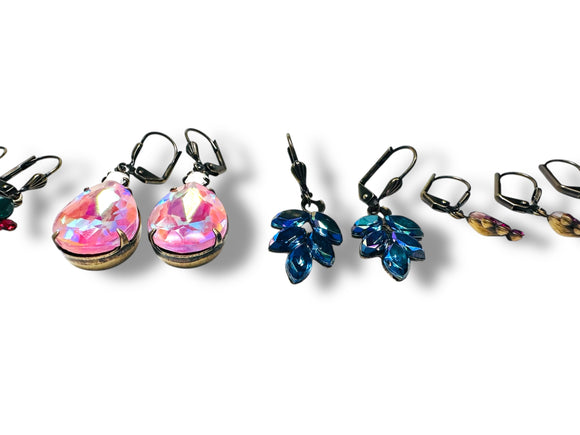 Set of colorful earrings on a white background