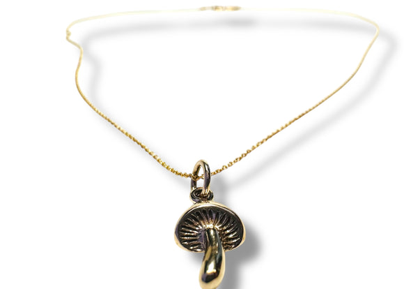 Half inch dainty bronze mushroom charm on a dainty gold filled chain. 