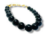 Dark green goldstone bracelet with gold plated chain.