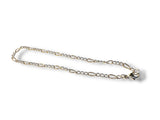Silver chain bracelet on a white background