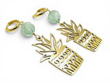 Fluorite Plant Earrings. Gold pineapple-shaped earrings with green beads on a white background