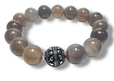 Beaded Agate bracelet with a silver and black bead on a white background