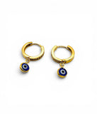 Gold hoop earrings with blue evil eye charms on a white background. Gold Evil Eye Hoops