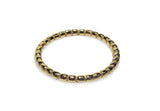 Gold bracelet on a white background