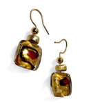 Gold and red glass earrings on a white background