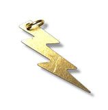 Gold lightning bolt pendant on a white background