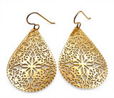 Gold teardrop-shaped earrings with intricate filigree design on a white background