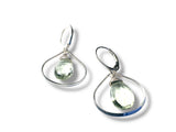 Pair of silver earrings with green gemstones on a white background
