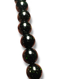 Close up of dark green goldstone 