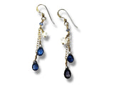 Pair of earrings with blue gemstones on a white background. Iolite and Herkimer Cascade Earrings