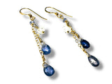 Gold earrings with blue and white beads on a white background. Iolite and Herkimer Cascade Earrings