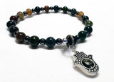 Beaded Jasper bracelet with a silver Hamsa hand charm on a white background
