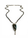 Necklace with a triangular pendant on a white background