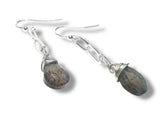 Silver earrings with labradorite stone beads on a white background