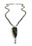 Necklace with a large pendant on a white background. Labradorite and Pearl Beaded Necklace.