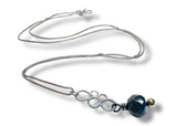 Necklace with a blue pendant on a white background Labradorite silver circle bubble necklace 