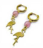 Gold flamingo-shaped earrings with pink beads on a white background