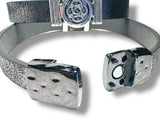 Bracelet with dice-shaped ends on a white background
