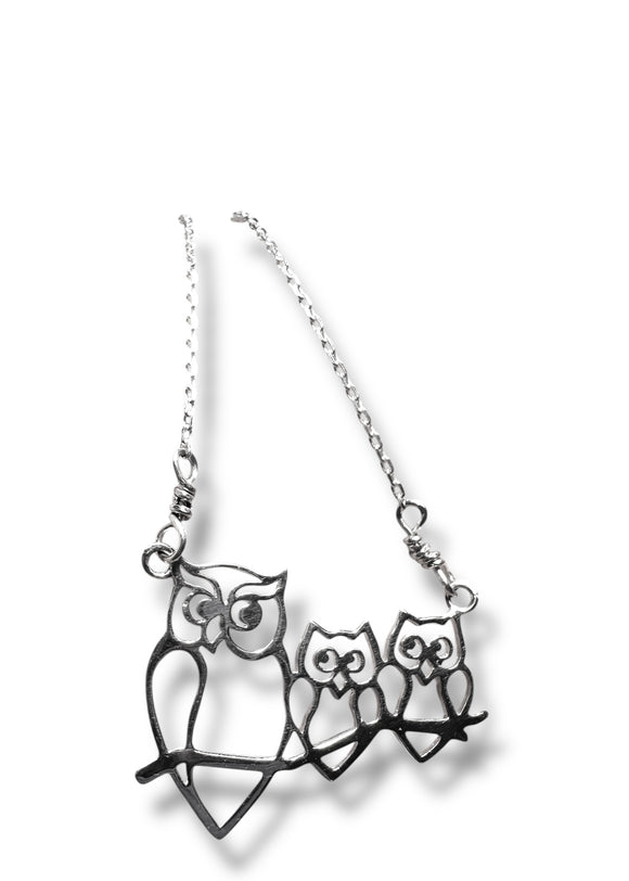 Silver owl family necklace on a white background