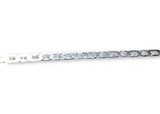Silver bracelet with clear gemstones on a white background. Mariner Chain Close Up