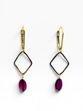 A pair of gold leverback drop earrings featuring a thin tortoiseshell diamond frame and a dangling oval purple gemstone, shown on a clean white background.
