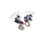 Multicolored gemstone earrings on a white background