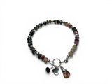 Multicolored Tourmaline beaded bracelet with charms on a white background