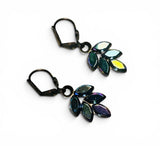 Multicolored leaf-shaped earrings on a white background