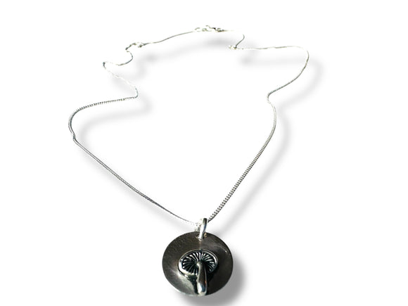 Necklace with a round pendant on a white background