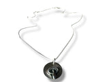 Necklace with a round pendant on a white background