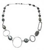 Necklace with Moonstone beads and silver loops on a white background
