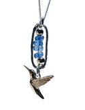 Necklace with a hummingbird pendant and blue beads on a white background
