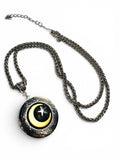 Necklace with a moon and star pendant on a white background