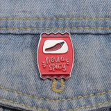 Neuro Spicy pin on a denim jacket