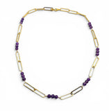 Gold chain necklace with purple beads on a white background. Paperclip Chain Amethyst Necklace.