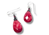 Pink teardrop earrings on a white background